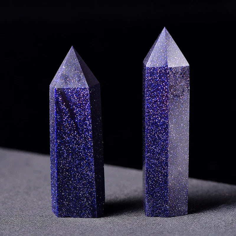 Two crystal towers with blue and gray coloration on a dark background