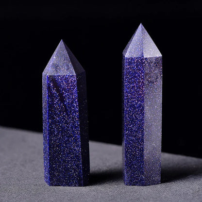 Two crystal towers with blue and gray coloration on a dark background