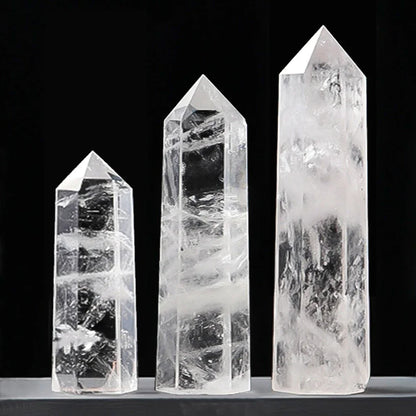 Three crystal towers of varying sizes on a black background